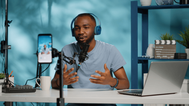 Man recording a video podcast with microphone setup
